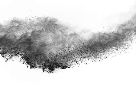 particles of charcoal on white background,abstract powder splatted on white background,Freeze motion of black powder exploding or throwing black powder.の写真素材