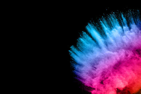 abstract colored dust explosion on a black background.abstract powder splatted background,Freeze...