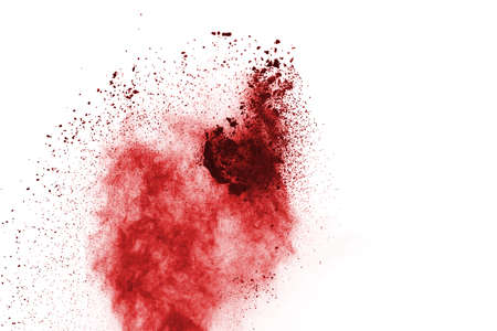Freeze motion of red powder exploding, isolated on white background. Abstract design of red dust cloud. Particles explosion screen saver, wallpaperの写真素材
