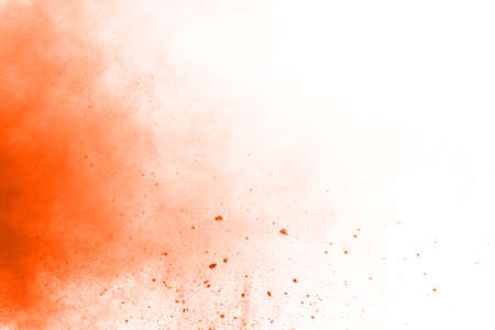 abstract orange powder splatted background,Freeze motion of color powder exploding/throwing color powder,color glitter texture on white background.の写真素材