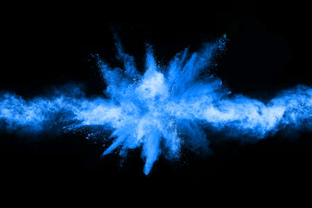Blue powder explosion on black background. Colored cloud. Colorful dust explode. Paint Holi.