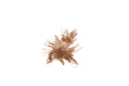 Brown color powder explosion on white background. Colored cloud. Colorful dust explode. Paint Holi.の写真素材