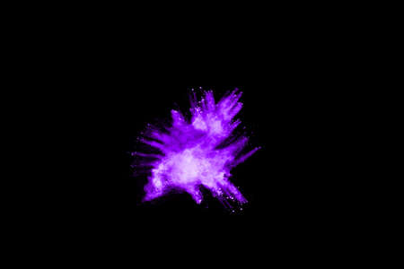 The movement of abstract dust explosion frozen purple on black background. Stop the movement of powdered purple on black background. Explosive powder purple on black background.の写真素材