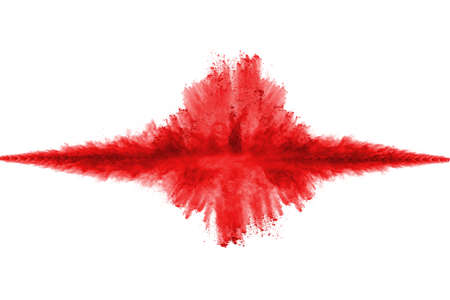 Freeze motion of red powder exploding, isolated on white background. Abstract design of red dust...