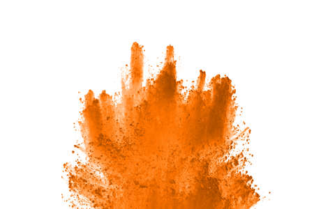 Orange powder explosion on white background. Paint Holi.
