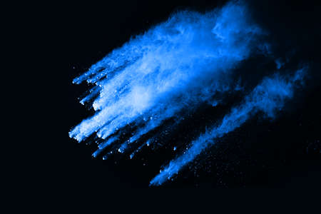 abstract blue powder splatted background,Freeze motion of color powder exploding/throwing color...