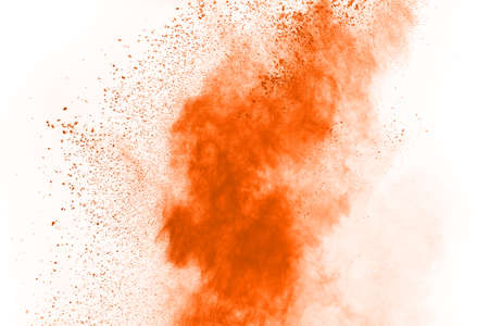 Orange powder explosion on white background. Paint Holi.