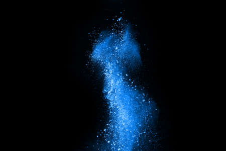 Blue color powder explosion on white background. Colored cloud. Colorful dust explode. Paint Holi.の写真素材