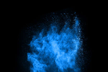 abstract blue powder splatted background,Freeze motion of color powder exploding/throwing color powder,color glitter texture on black background.の写真素材