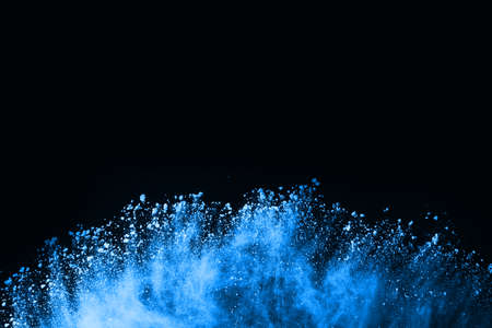 abstract blue powder splatted background,Freeze motion of color powder exploding/throwing color powder,color glitter texture on black background.の写真素材