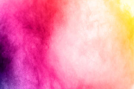 Abstract powder splatted background. Colorful powder explosion on white background. Colored cloud. Colorful dust explode. Paint Holi.の写真素材
