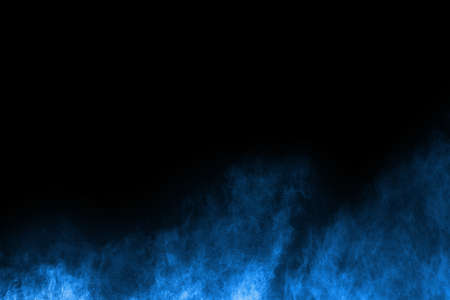 abstract blue powder splatted background,Freeze motion of color powder exploding/throwing color powder,color glitter texture on black background.の写真素材