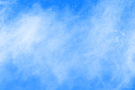 Blue color powder explosion on white background. Colored cloud. Colorful dust explode. Paint Holi.