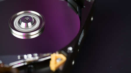 Disassembled hard drive from the computer, hdd with mirror effect Opened hard drive from the computer hdd with mirror effects Part of computer pc, laptop Closeup HDDの写真素材