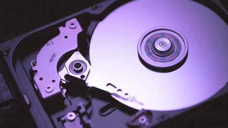 Disassembled hard drive from the computer, hdd with mirror effect Opened hard drive from the computer hdd with mirror effects Part of computer pc, laptop Closeup HDDの写真素材