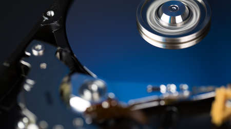 Disassembled hard drive from the computer, hdd with mirror effect Opened hard drive from the...