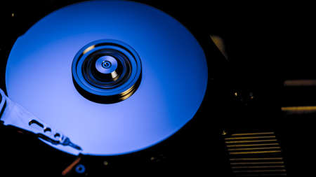 Disassembled hard drive from the computer, hdd with mirror effect Opened hard drive from the...