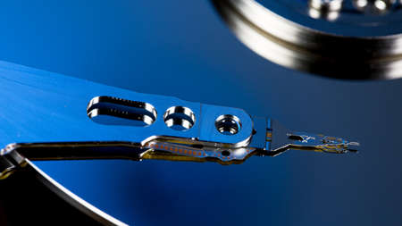 Disassembled hard drive from the computer, hdd with mirror effect Opened hard drive from the...