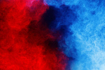 Blue and Red color powder explosion on black background. Colored cloud. Colorful dust explode. Paint...