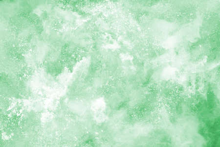 Green powder explosion on white background. Colored cloud. Colorful dust explode. Paint Holi.
