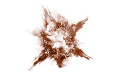 Brown color powder explosion on white background. Colored cloud. Colorful dust explode. Paint Holi.