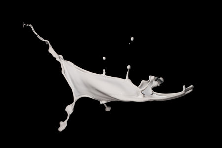 milk splash isolated on black background. white milk splash isolated on black backgroundの写真素材