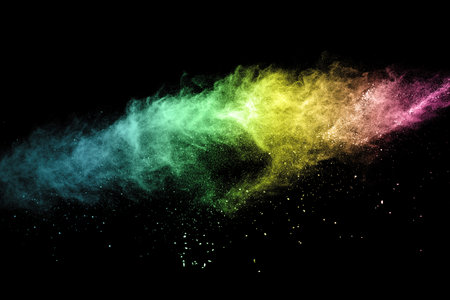 Explosion of colored powder, isolated on black background. Abstract colored backgroundの写真素材