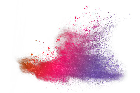 Explosion of colored powder, isolated on white background. Abstract colored backgroundの写真素材