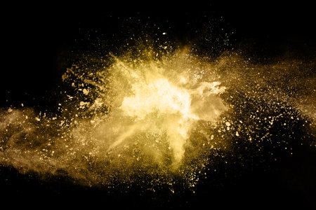 Explosion of colored powder on black background. Freeze motion of colored dust particles.の写真素材