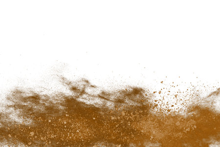 Brown powder explosion on white background. Colored cloud. Colorful dust explode. Paint Holi.の写真素材