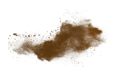 Explosion of brown powder isolated on white background. Abstract colored backgroundの写真素材