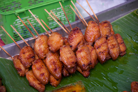 Grilled chicken wing with wood stickの写真素材