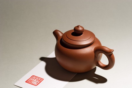 A Chinese purple clay teapot with gray background.のeditorial素材