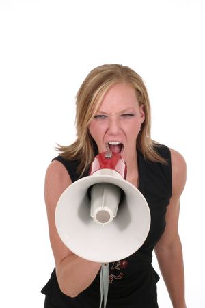 Attractive young executive business woman making her point really clear with the aid of a megaphone.の写真素材