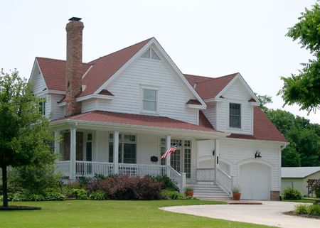 Modern classic new old house design in suburban community flying the US flag out frontの写真素材