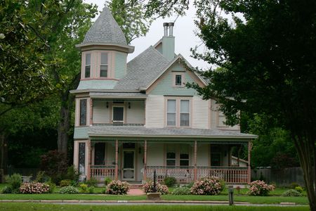 Extremely ornate and colorful restored Victorian era house in rural cityの写真素材