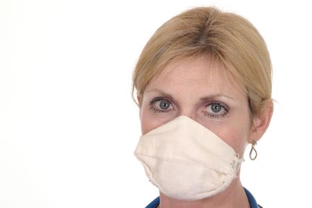 headshot photo of beautiful nurse or doctor with stethoscope and surgical maskの写真素材