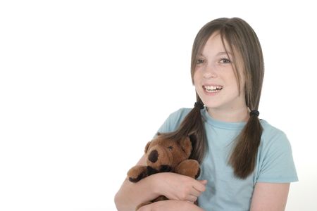Little girl with big smile, holding a teddy bear.  Shot on white.の写真素材
