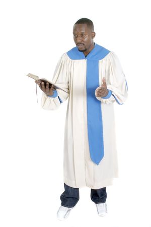 Man wearing a robe, holding a Bible, and preaching.の写真素材