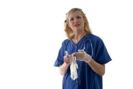 photo of nurse with stethoscope preparing syringe by removing air bubbles; isolated on white backgroundの写真素材