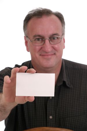 smiling man wearing glasses holding blank white card suitable for text; isolated on whiteの写真素材