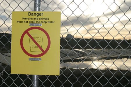 Danger Human and animals must not drink the seep water sign on Navajo Indian Reservation (Navajo Nation) near Shiprock, New Mexicoの写真素材