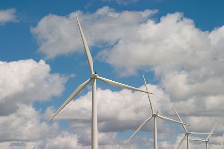 Wind turbines on a wind farm harvesting a renewable energy resource.の写真素材