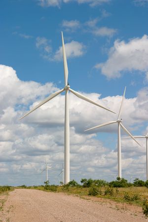 Wind turbines on a wind farm harvesting a renewable energy resource.の写真素材