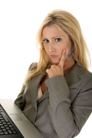 Beautiful blonde customer service representative has a worried or confused facial expression.の写真素材