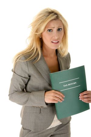 Beautiful blonde woman is shocked and bewildered by her tax return problems. Other text could be substituted for the の写真素材