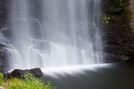 Bottom of Looking Glass Falls in North Carolina in early morning lightの写真素材