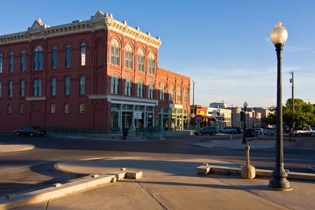 Very quiet day in a typical midwest small town square with a late summer afternoon sun casting long shadows.の写真素材