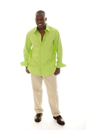 Casual young African American man standing in a bright green shirt.の写真素材