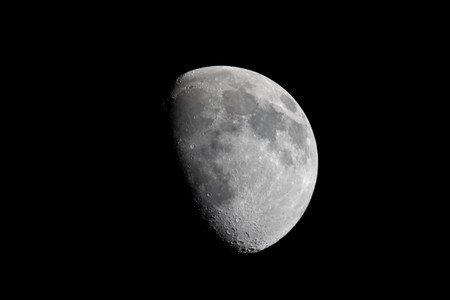 Actual photographic view of the waxing gibbous moon taken at prime focus (telescope mirror is the lens) through an 8 inch Newtonian reflector telescope.  Natural isolation against a black sky.の写真素材
